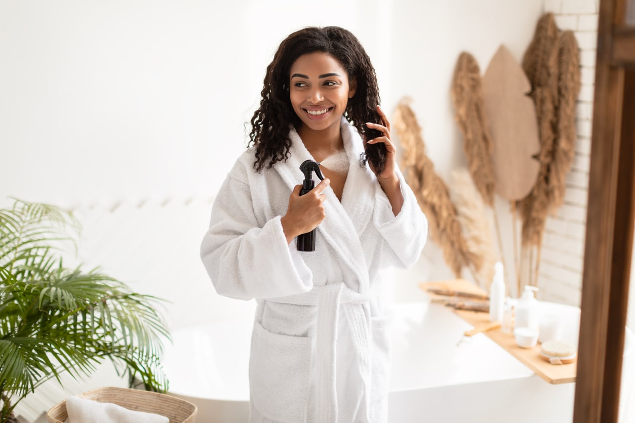 Woman using a hair protectant